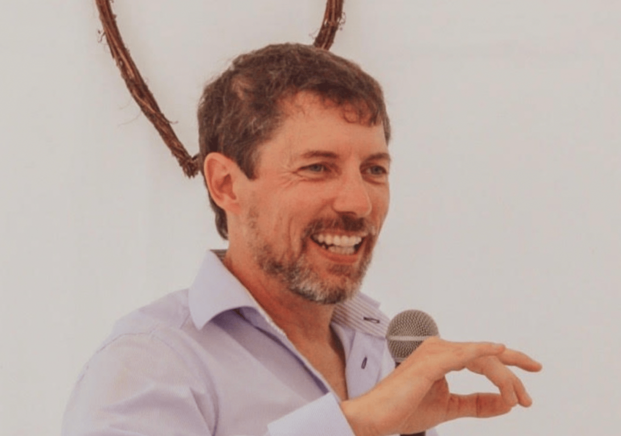 Jamie speaking in front of a crowd